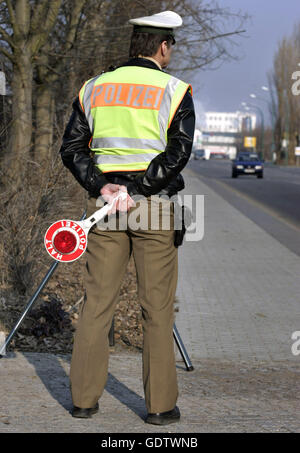 Police Signalling Disc Policeman with signalling disc during a road check Stock Photo - Alamy