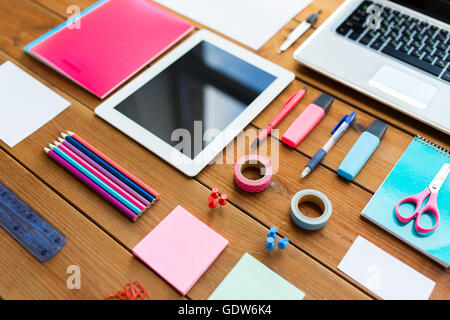 close up of school supplies and tablet pc Stock Photo