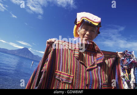 People at the coast of Lake Atitlan mit the Volcanos of Toliman and San Pedro in the back at the Town of Panajachel in Guatemala Stock Photo