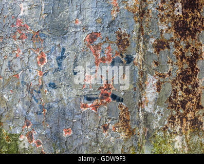 Old layers of paint revealing  rusting, cast iron background. Stock Photo