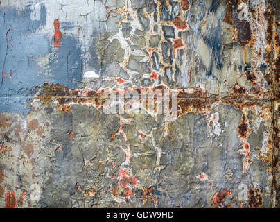 Old layers of paint revealing  rusting, cast iron background. Stock Photo