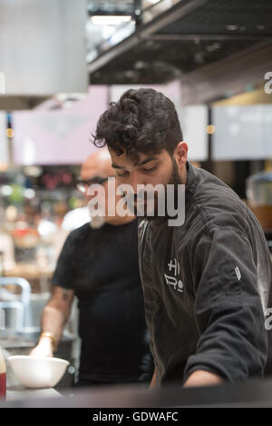 Chef Yisrael Aharoni cooking at his 'Hiro, free style ramen bar' restaurant in Sarona market, Tel Aviv, Israel Stock Photo