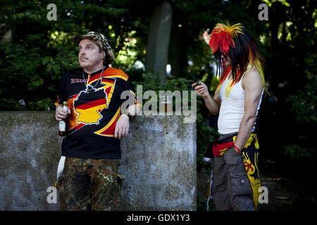 Football fans drink beer on the German Fan Mile at the World Cup in Berlin, Germany, 2010 Stock Photo