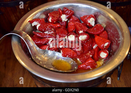 Red bell peppers stuffed with feta cheese Stock Photo