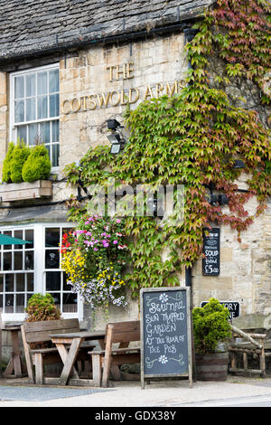 Hanging basket and floral display outside The Cotswolds Arms pub, Burford, Oxfordshire, England Stock Photo