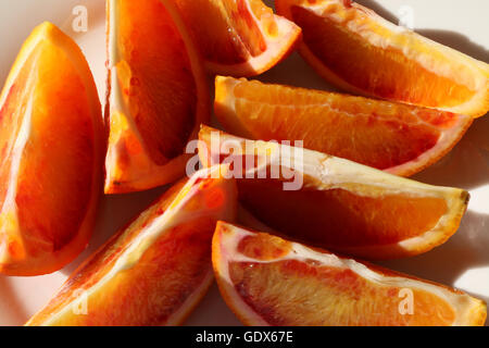 Fresh Blood Orange sliced on a plate showing details of the fruit Stock Photo
