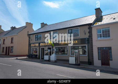 O'Garas bar with petrol fuel pumps outside at Kilcar, County Donegal, Ireland. Known as Cill Charthaigh in Irish language Gaelic Stock Photo