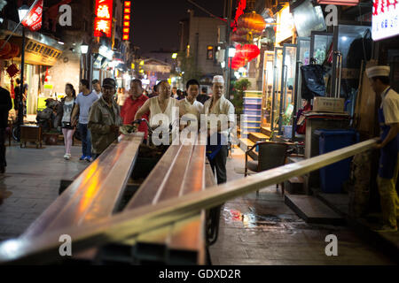 Street Life in the Shitou and Dashilar hutong area, in Beijing, China. Stock Photo