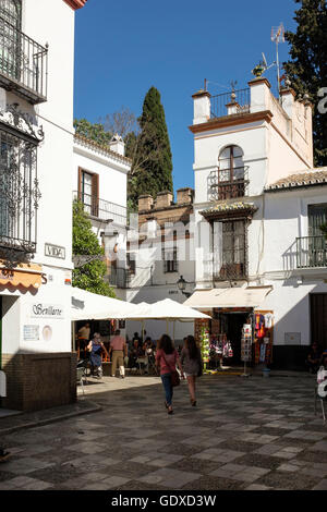 Calle Vida, where it passes through a small square, into Calle Agua, in the old Juderia district of Santa Cruz, Seville, Spain.