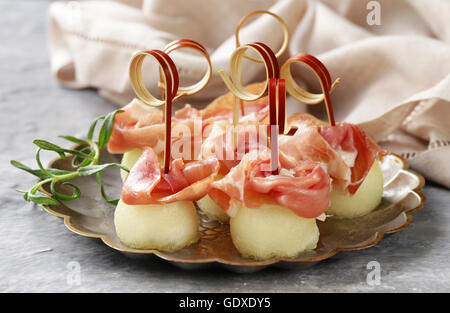 traditional Italian appetizer parma ham with melon - prosciutto melone Stock Photo