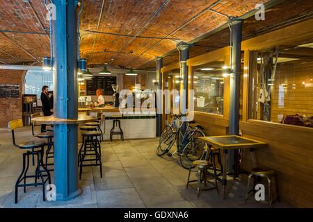 The 'Ancoats Coffee' cafe inside the historic Royal Mill complex, Redhill Street, Ancoats, Manchester, England, UK Stock Photo