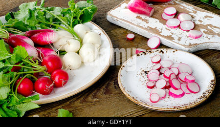 Organic radishes on rustic wooden table. Top view Stock Photo