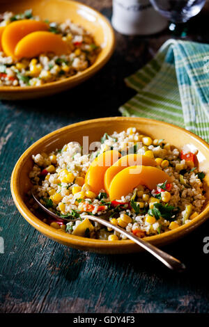 Plates of refreshing summer bulgar salad with fresh vegetables Stock Photo