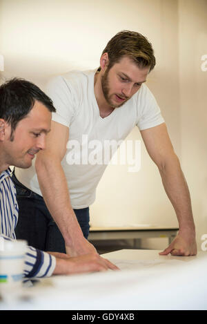 Architects discussing about project in the office, Bavaria, Germany Stock Photo