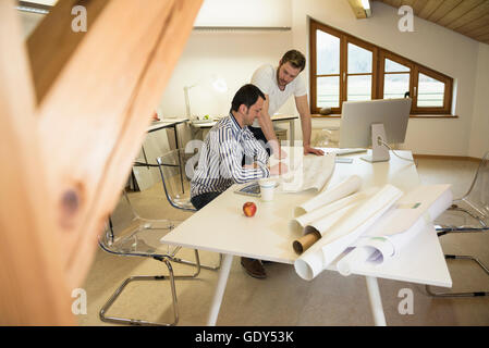 Architects discussing about project in the office, Bavaria, Germany Stock Photo