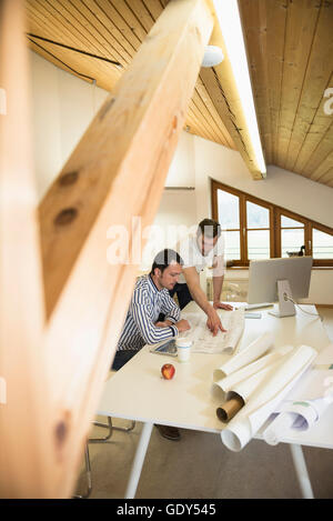 Architects discussing about project in the office, Bavaria, Germany Stock Photo