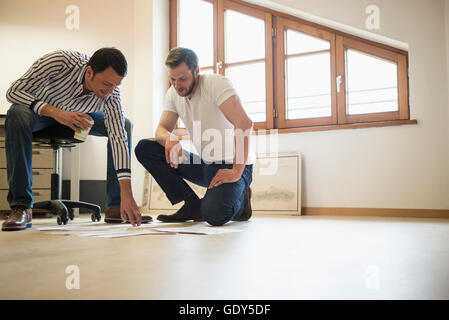 Architects discussing about project in the office, Bavaria, Germany Stock Photo