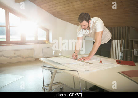 Architect making a blueprint in the office, Bavaria, Germany Stock Photo