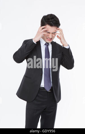 Stressful business man having a headache Stock Photo