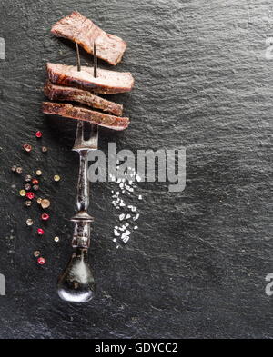 Steak Rib eye with spices on the wooden tray. Stock Photo