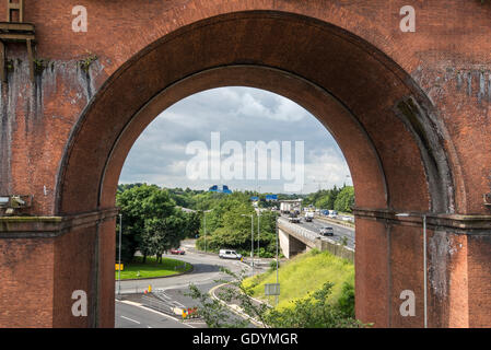 View beneath one of the arches of Stockport viaduct in Northwest England. The M60 motorway and the pyramid can be seen. Stock Photo