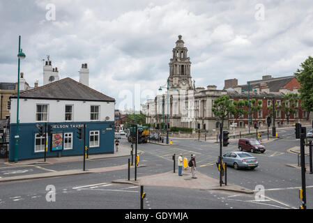 Junction on the A6 in Stockport with the town hall and Nelson tavern. Greater Manchester, England. Stock Photo