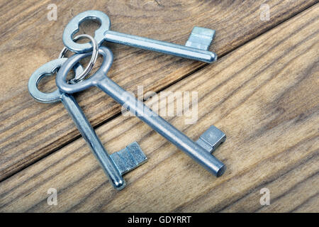 Closeup of keys on wooden table Stock Photo