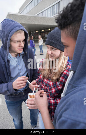 university students smoking cigarettes in campus, Bavaria, Germany Stock Photo