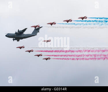 Airbus A400M military transport aircraft flying with the Red Arrows at the 2016 FArnborough International Airshow Stock Photo