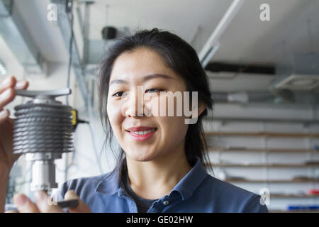 Young female engineer working in an industrial plant, Freiburg im Breisgau, Baden-Württemberg, Germany Stock Photo