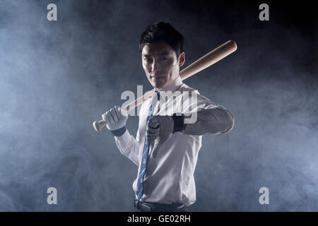Business man posing with a baseball bat Stock Photo