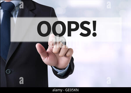 OOPS! Businessman hands touching on virtual screen and blurred city background Stock Photo