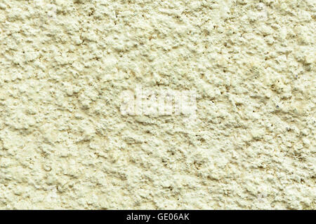 Plastered concrete surface with an uneven rough texture, painted in a light green color Stock Photo
