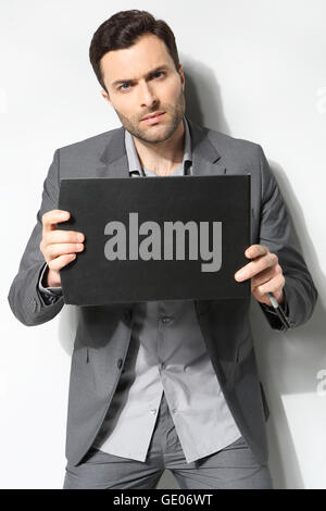 Portrait of a handsome business man ,Isolated on gray Stock Photo