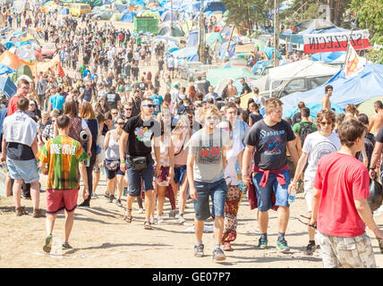 People walking among festival attractions on the 21th Woodstock Festival Poland. Stock Photo