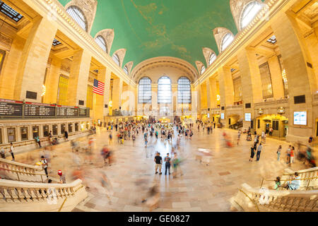 New York, USA - August 15, 2015: Fisheye lens picture of commuters in the Grand Central Terminal main hall during busy day. Stock Photo