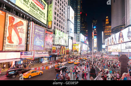 New York, USA - August 18, 2015: Times Squares crowded with tourists at night with Broadway Theaters and animated LED signs. Stock Photo