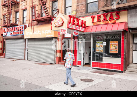 Man walking on a street of Harlem, New York City. Stock Photo