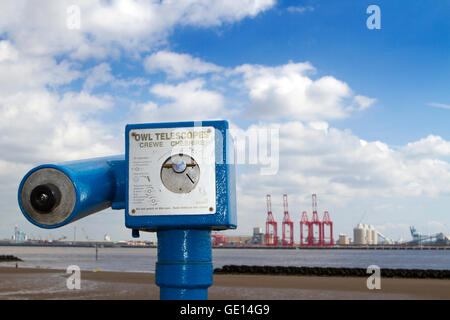 Owl Telescope on New Brighton Seafront Looking across to Seaforth Container docks, Liverpool, Merseyside, UK Stock Photo