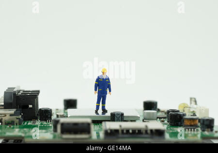 mini single engineer stand on mainboard isolate - can use to display or montage on products Stock Photo