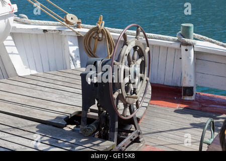 Old wooden wheel on old sailing ship at Amerikakaj in the northern part of Copenhagen Harbour. Stock Photo