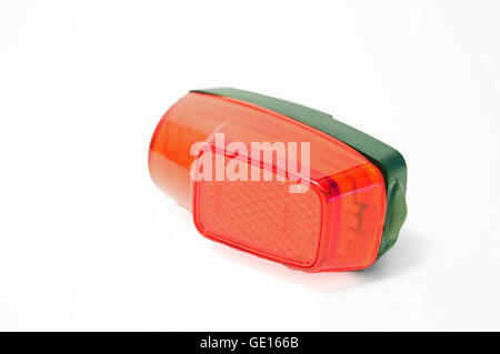 A red bicycle tail light on a white background. Stock Photo