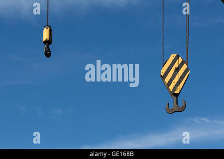 crane hook closeup on blue sky background Stock Photo