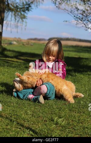 child and cat Stock Photo