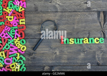 Insurance word on wooden table Stock Photo