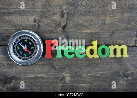 Freedom word on wooden table Stock Photo