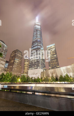 New York, USA - September 13, 2015: Night picture of The National September 11 Memorial pool and Freedom Tower. Stock Photo