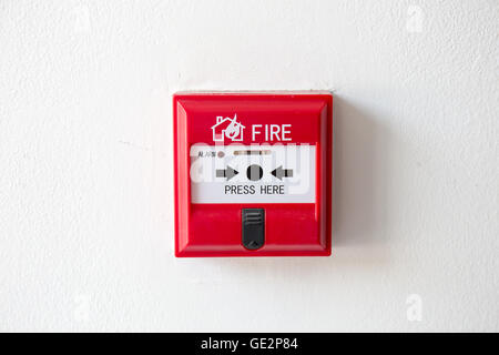 Push button switch fire alarm box on cement wall for warning and security system Stock Photo