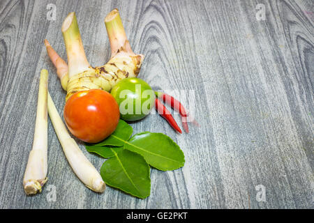 Herb set of Tom Yum Soup Ingredients for Thai food on wood background Stock Photo