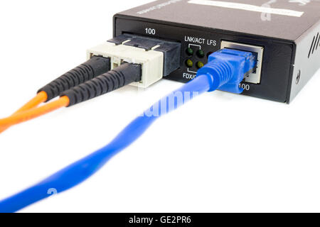 Close up fiber media converter and cables on white isolated background Stock Photo